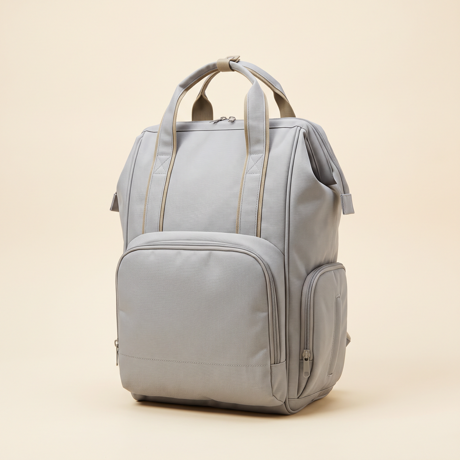 Bolso pañalera morral gris en tela Oxford con asas superiores